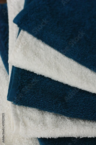 White and blue bath towels close up view 