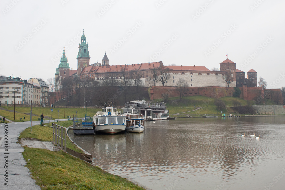 The most famous Polish Royal Cracow Wawel Castle on Christmas Day in rainy weather.