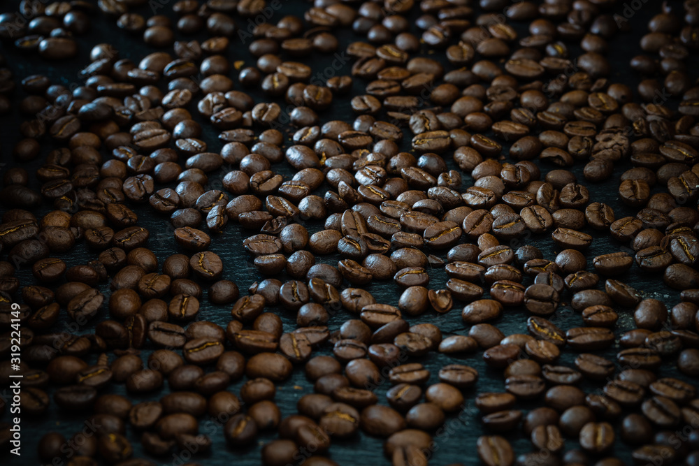 Coffee beans on a black background - dark food photography Coffee beans on a black background - dark food photography