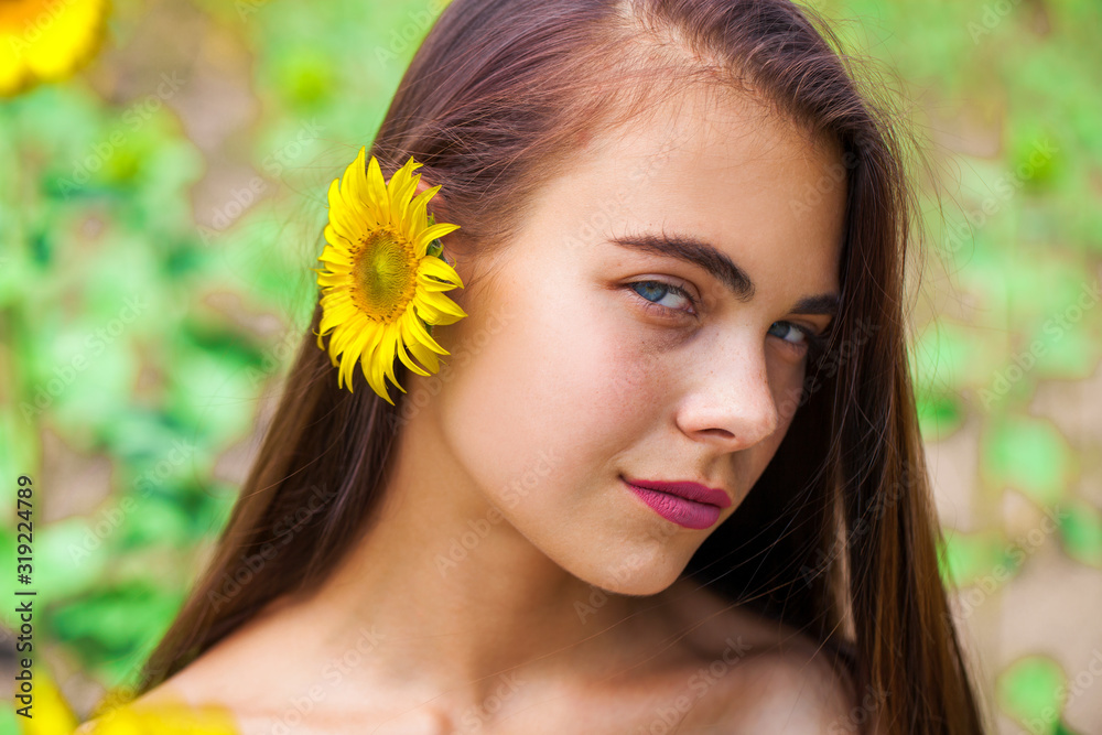 Photo of pretty brunette woman in sunflowers field Photo of pretty brunette woman in sunflowers field