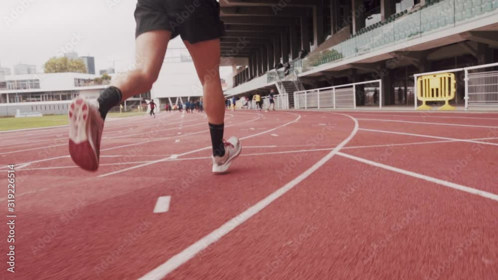 young man running on a track