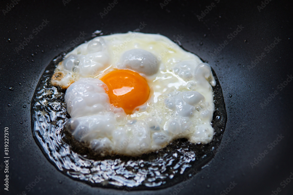 Close up fried egg, traditional healthy easy meal Close up fried egg, traditional healthy easy meal