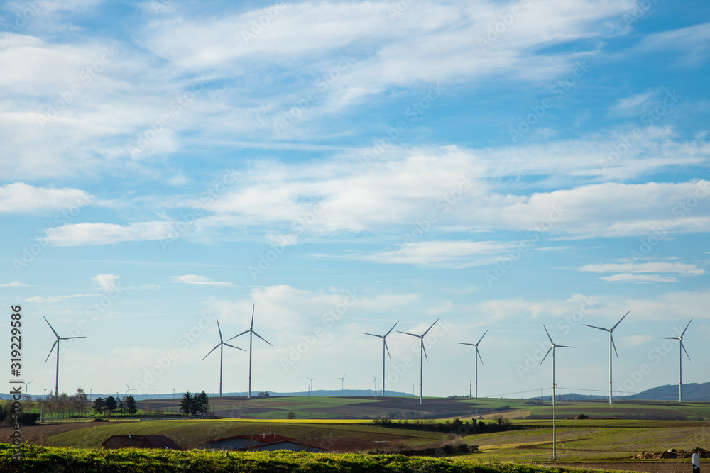 Green Energy Beauty Landscape With Group of Windmill at Sunny Day Green Energy Beauty Landscape With Group of Windmill at Sunny Day