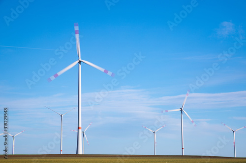 Green Energy Beauty Landscape With Group of Windmill at Sunny Day