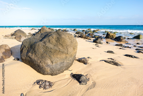 Fototapeta Naklejka Na Ścianę i Meble -  Stones on sandy beach
