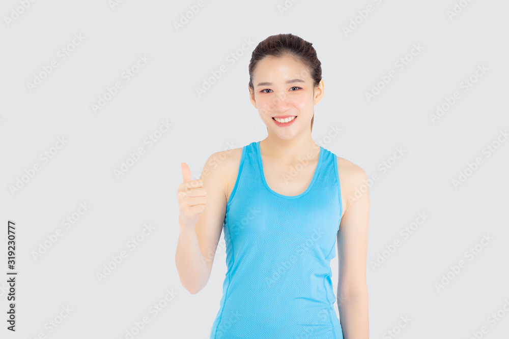 Beautiful portrait young asian woman in sport clothes with satisfied and confident gesture thumbs up isolated on white background, asia girl have shape and wellness, exercise for fit with health. Beautiful portrait young asian woman in sport clothes with satisfied and confident gesture thumbs up isolated on white background, asia girl have shape and wellness, exercise for fit with health.