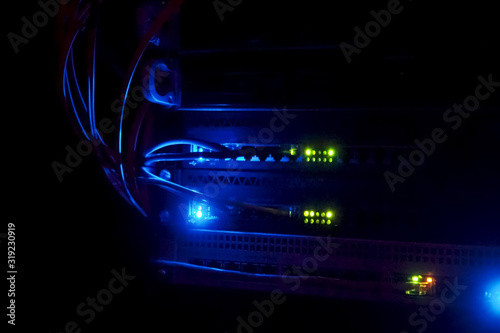 working server. Internet wires and flashing lights on the server.