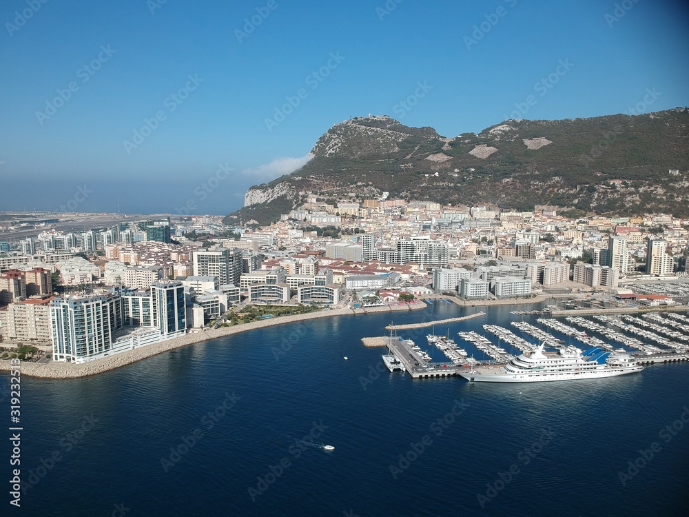 Aerial view on the Gibraltar city harbor at summer sun light