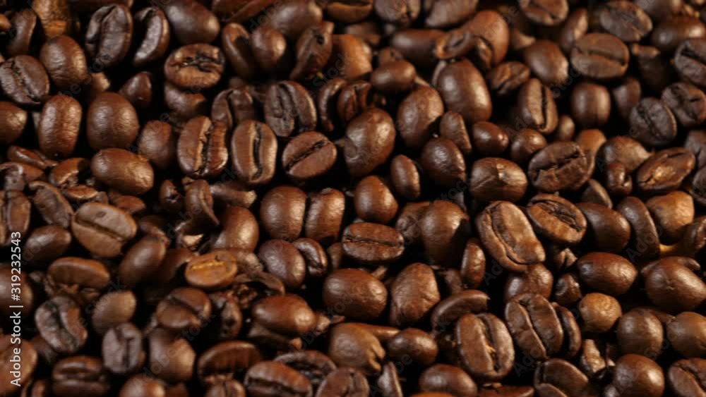Coffee beans. Coffee. Drink. Beautiful grains. Making coffee. Coffee beans are lying. Warm light. Panorama from left to right. Close-up Coffee beans. Coffee. Drink. Beautiful grains. Making coffee. Coffee beans are lying. Warm light. Panorama from left to right. Close-up