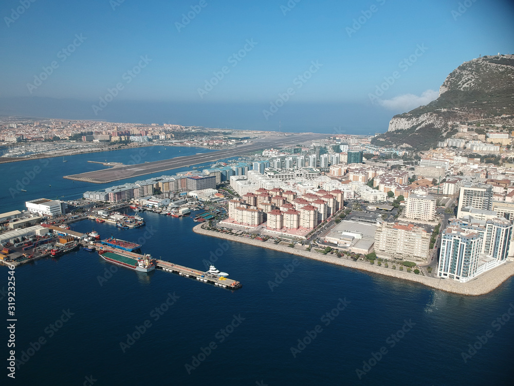 Aerial view on the Gibraltar city harbor at summer sun light