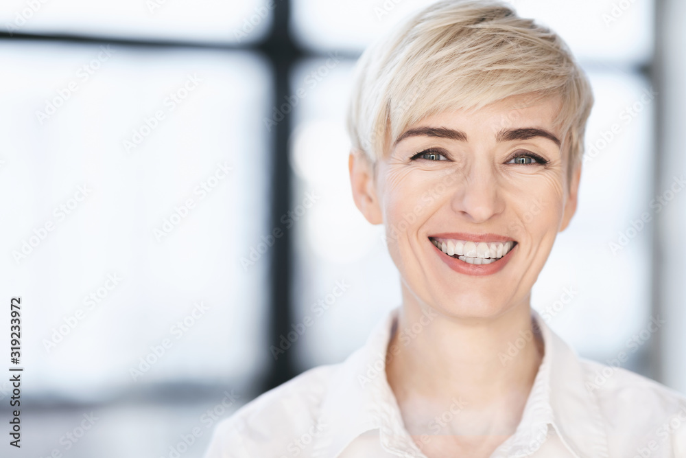 Middle Aged Businesswoman Smiling To Camera Posing In Modern Office Middle Aged Businesswoman Smiling To Camera Posing In Modern Office