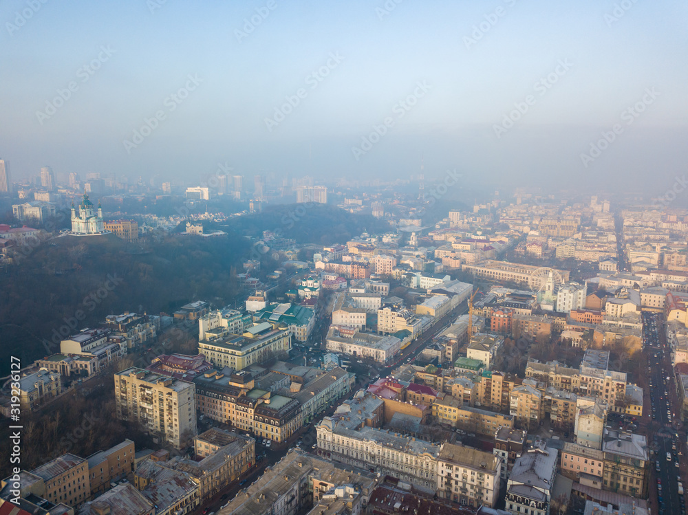 Fototapeta premium Aerial drone view. View of the historical part of Kiev on a foggy morning.