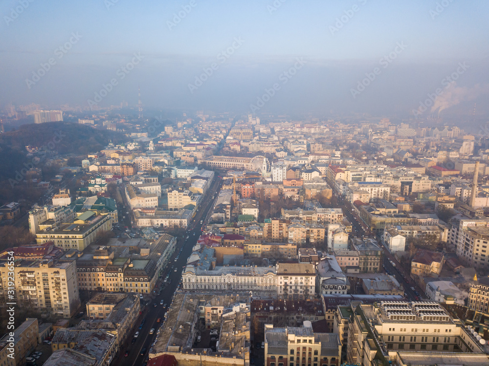 Aerial drone view. View of the historical part of Kiev in a foggy morning.