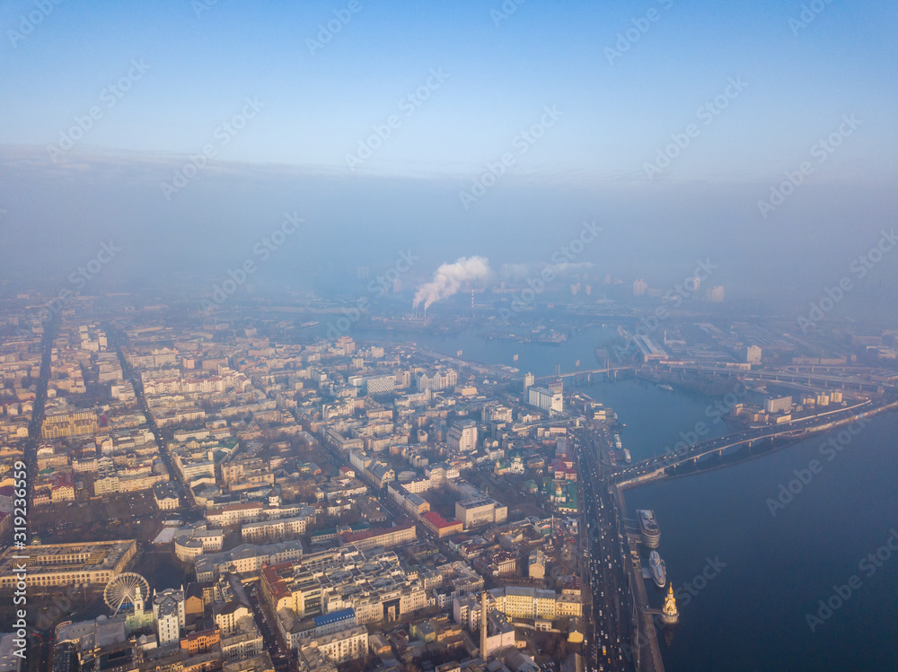 Obraz premium Aerial drone view. View of the historical part of Kiev and the Dnieper River on a foggy morning.