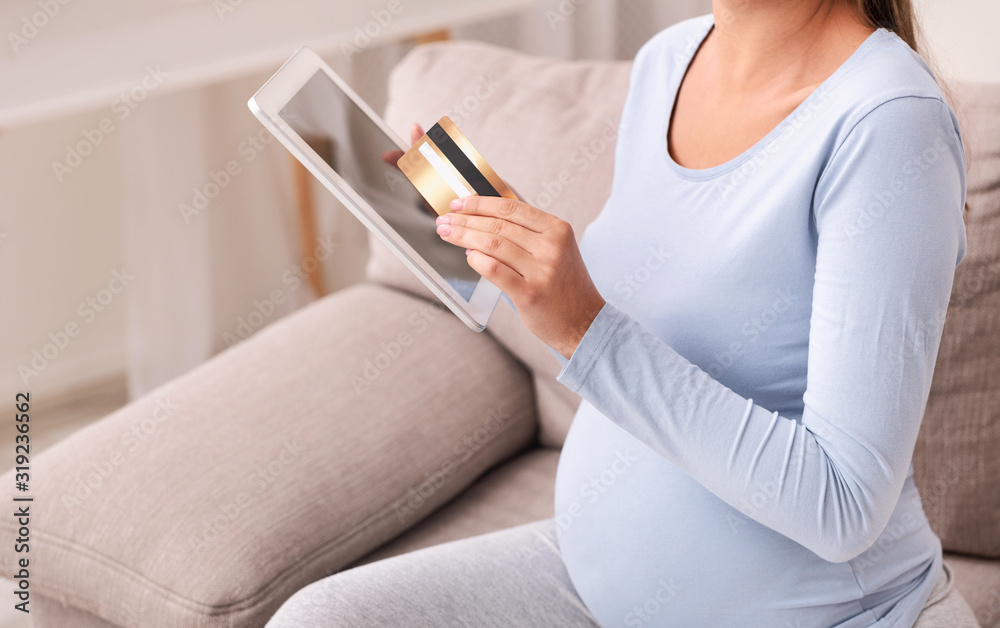 Unrecognizable Pregnant Lady Shopping Online Using Tablet Sitting On Sofa Unrecognizable Pregnant Lady Shopping Online Using Tablet Sitting On Sofa