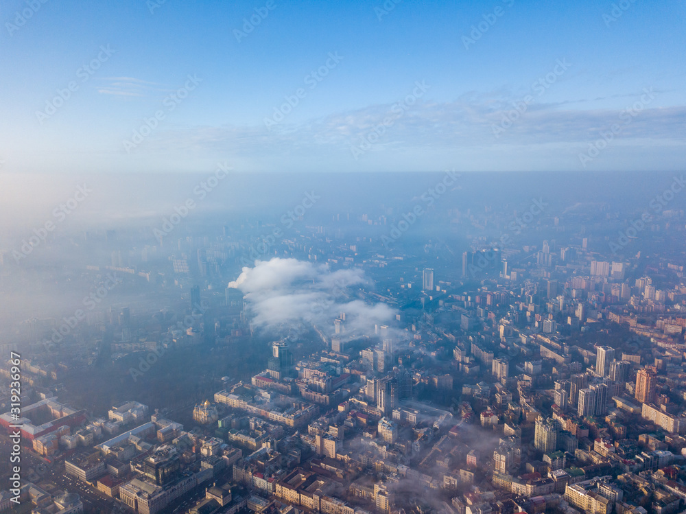 Aerial drone view. Houses in the city center of Kiev on a foggy morning.
