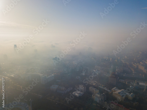 Aerial drone view. View of the city of Kiev in a foggy morning.