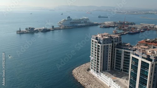 Aerial view on the Gibraltar city harbor at summer sun light