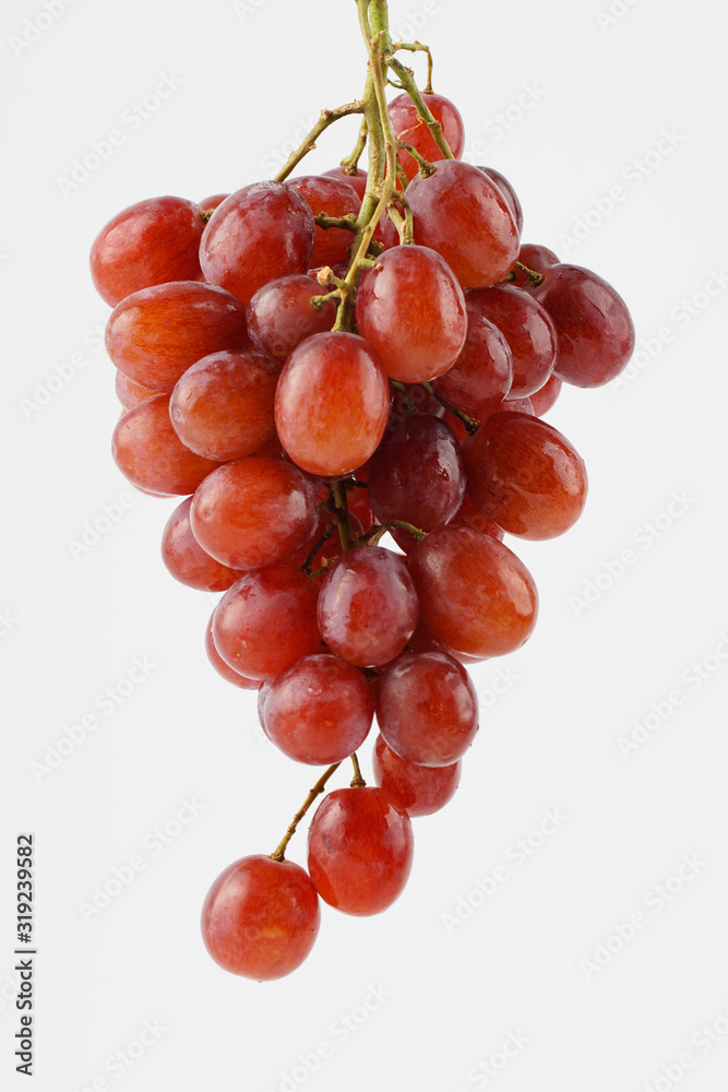 Fototapeta premium Red grape isolated over white background