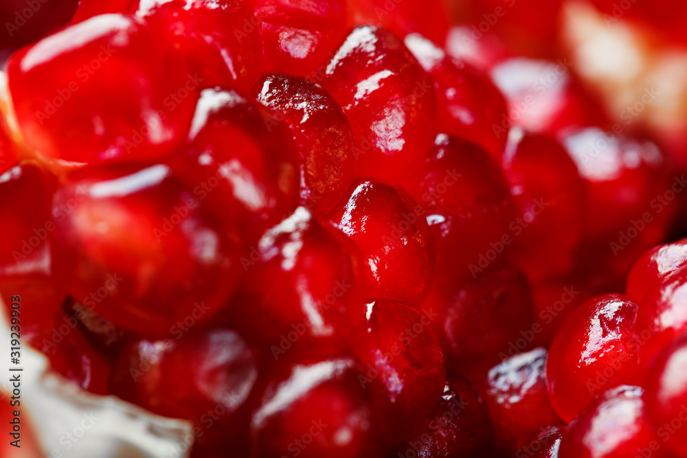 Red ripe and juicy seeds of fresh pomegranate fruit close-up. Red ripe and juicy seeds of fresh pomegranate fruit close-up.