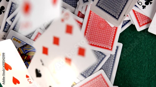 Playing Cards Falling on Green Felt Table