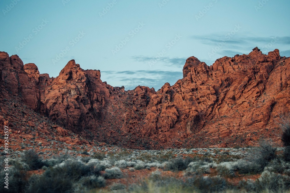 The last sun rays on red mountains in Valley of fire