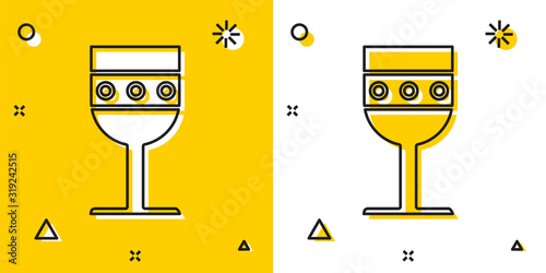 Black Medieval goblet icon isolated on yellow and white background. Random dynamic shapes. Vector Illustration