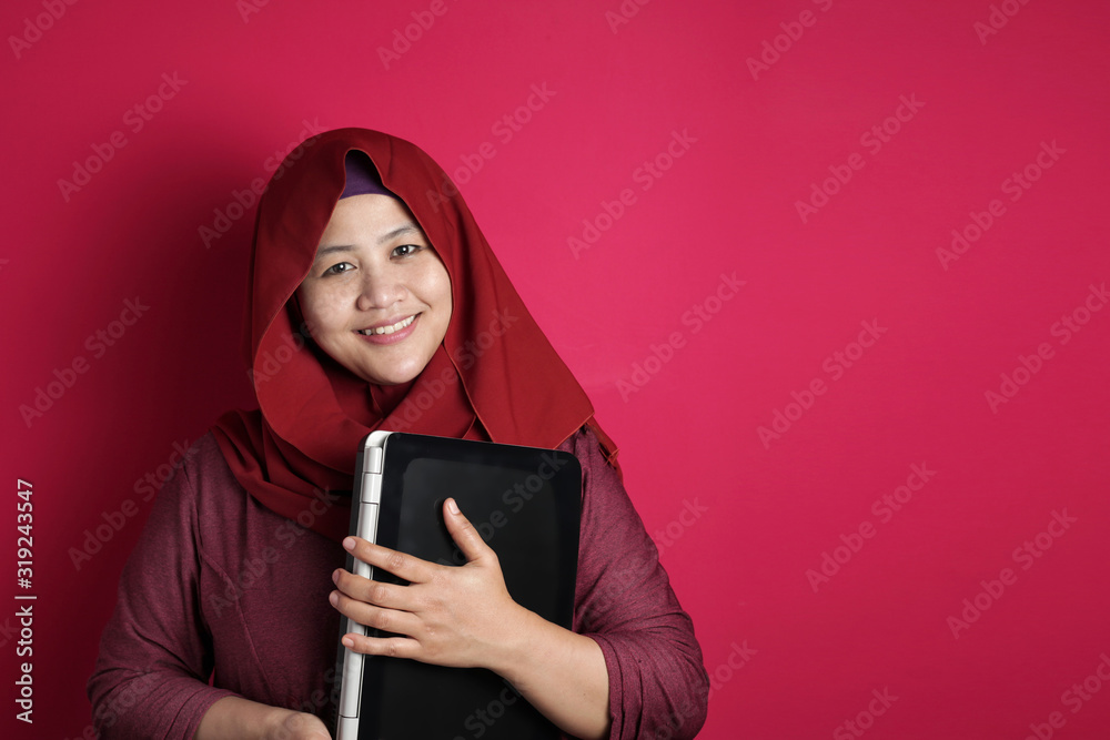 Muslim Woman Holds Laptop Muslim Woman Holds Laptop