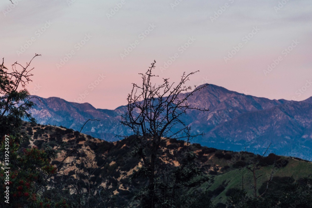 Sunsets behind the mountains in Los Angeles, California Sunsets behind the mountains in Los Angeles, California