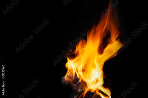 Fire flames and Smoke on black background. Image of blaze fire flame texture and burning fire for decorative special effect . © Nitiphonphat