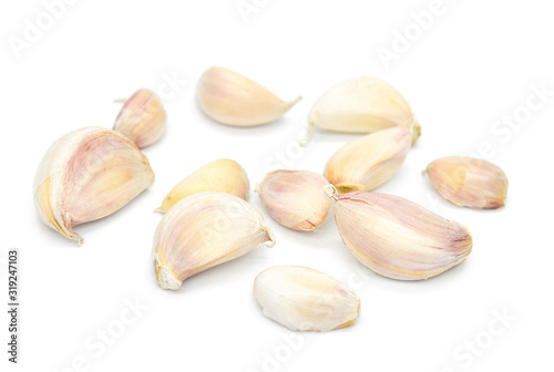 Close-Up View of Raw Garlic Segments on White Background