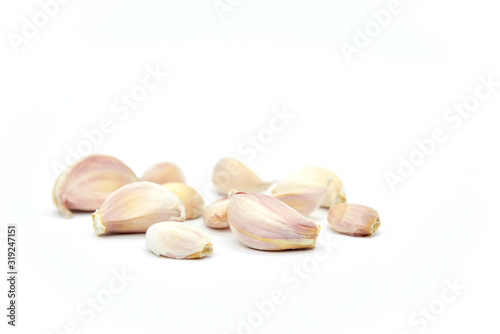 Raw Garlic Segments Isolated on White Background