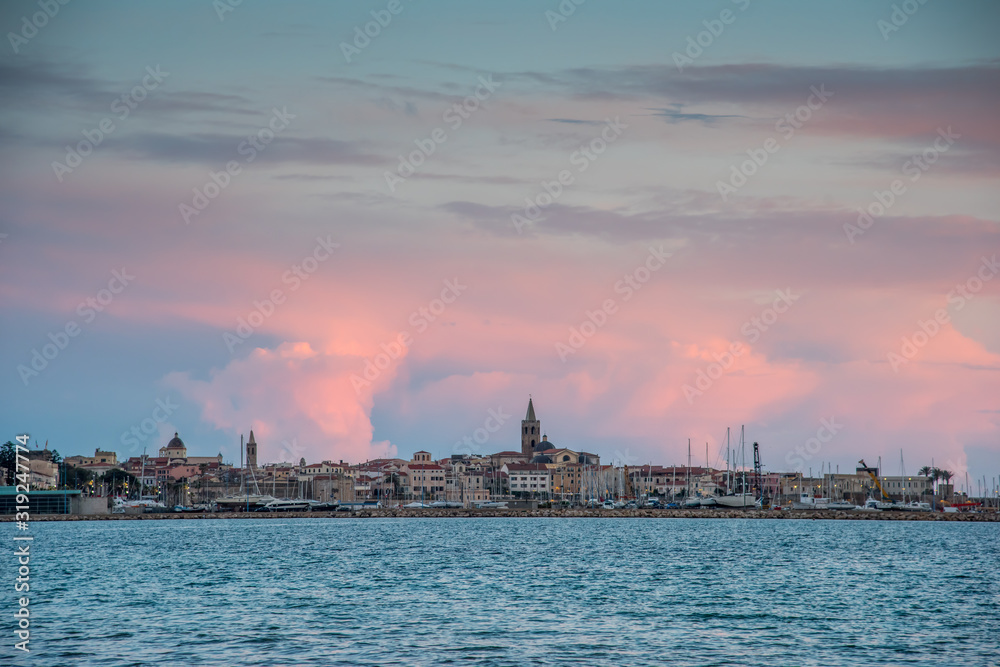 Pink clouds over Alghero at sunset