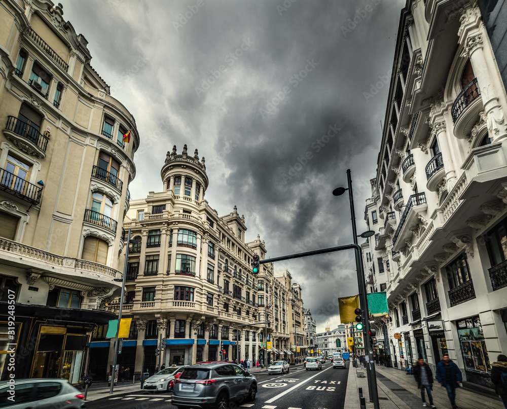 Dramatic sky over Gran Via boulevard in downtown Madrid