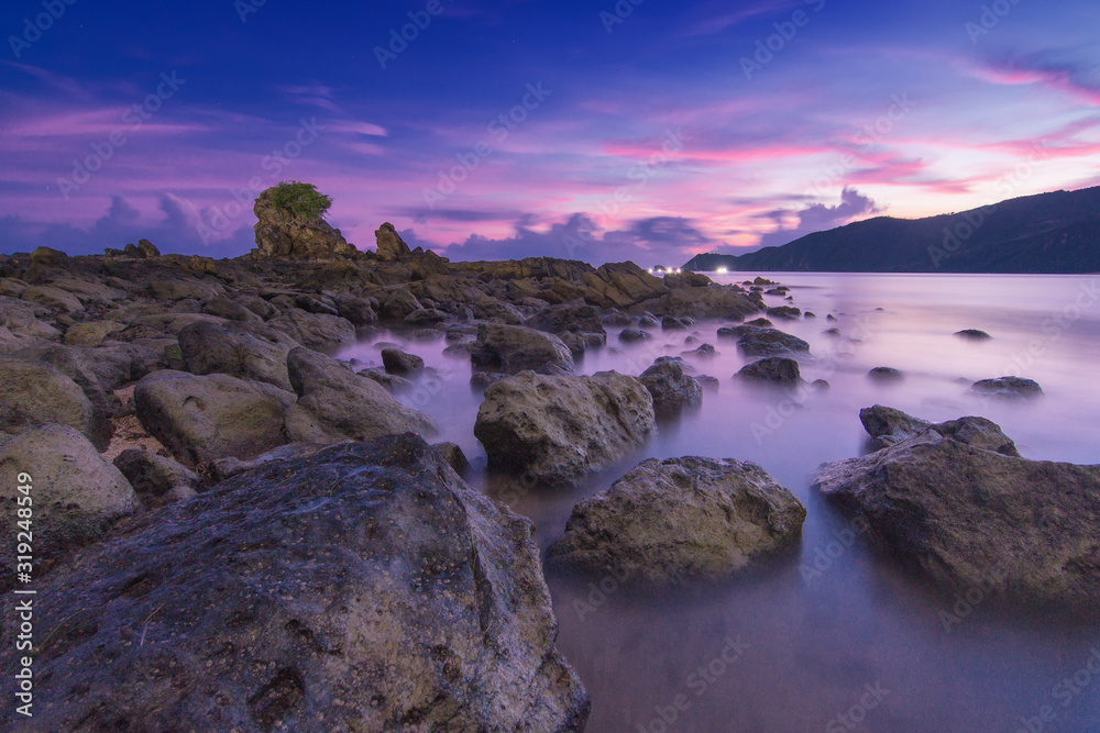 sunset on coast of sea long exposure