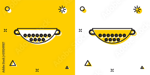 Black Kitchen colander icon isolated on yellow and white background. Cooking utensil. Cutlery sign. Random dynamic shapes. Vector Illustration