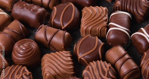 Assorted pralines with milk and dark chocolate. Loving chocolate and sweets concept. Dolly shot 4k