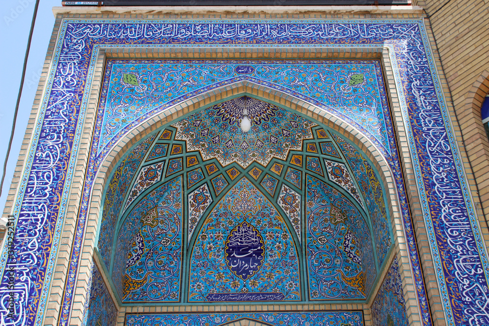 Qum, Iran - May 4, 2017: stunning beauty of the ancient Shiite mosque Jamkaran is one of the primary signifier of mosques. Painting and mosaic details in blue color.
