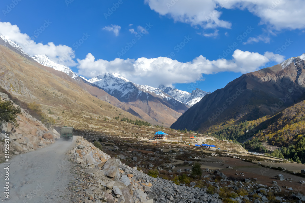 Beautiful greater Himalayas Valley with snow line soaring heights, steep side jagged peaks, alpine glaciers, river gorges erosion and landslides topography, geologic environment flora, fauna, climate.