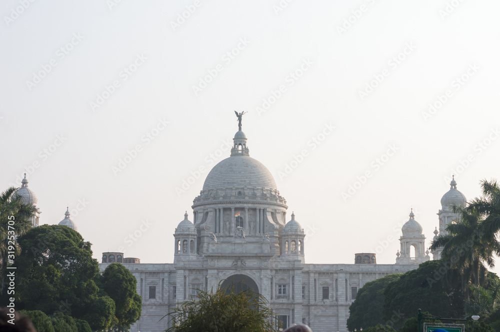 The Victoria Memorial, white marbled opulent structure iconic infrastructure of the old Imperial British Raj, a museum and tourist destination and heritage place. Kolkata, West Bengal, India May 2019