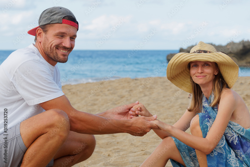 Couple on beach laughing having fun lifestyle.. Couple on beach laughing having fun lifestyle..