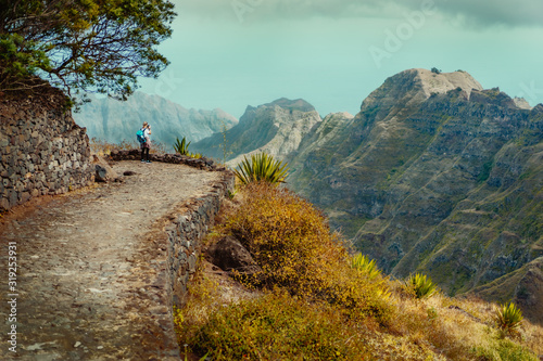 Santo Antao Island Cape Verde. Female tourist enjoying view to Caculi valley on hike from Corda photo