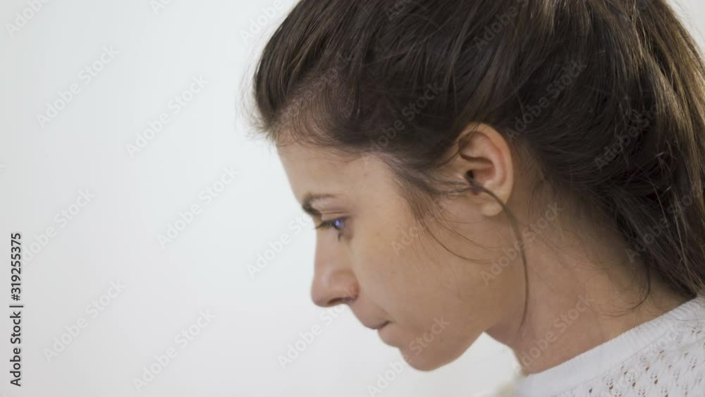 Close view of beautiful brunette girl talking and turning aginst the camera smiling Close view of beautiful brunette girl talking and turning aginst the camera smiling
