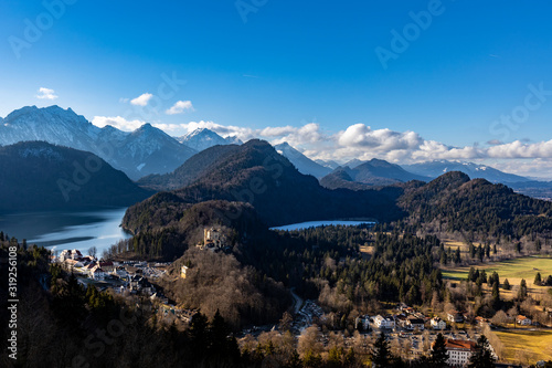 Panorama view of the Bavarian Alps and Lake with the famous Hohenschwangau Castle and Alpsee lake, Schwansee lake in winter