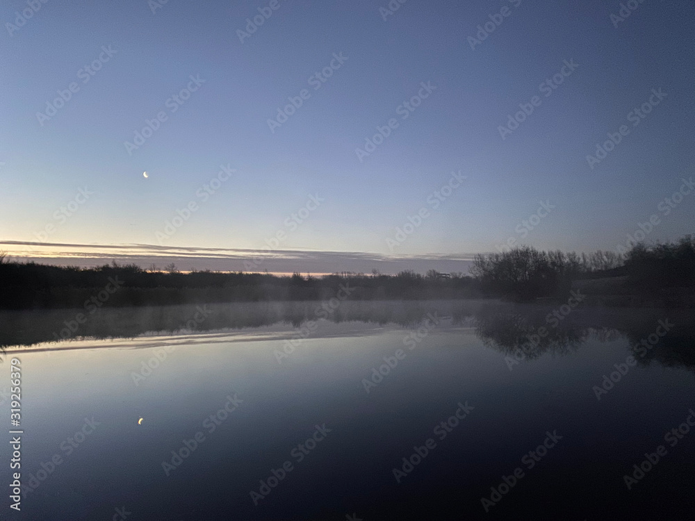Morning sunrise by the Lake and slight fog