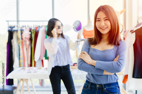 young new SME business owner happy and successful teen portrait with fashion clothing shop background
