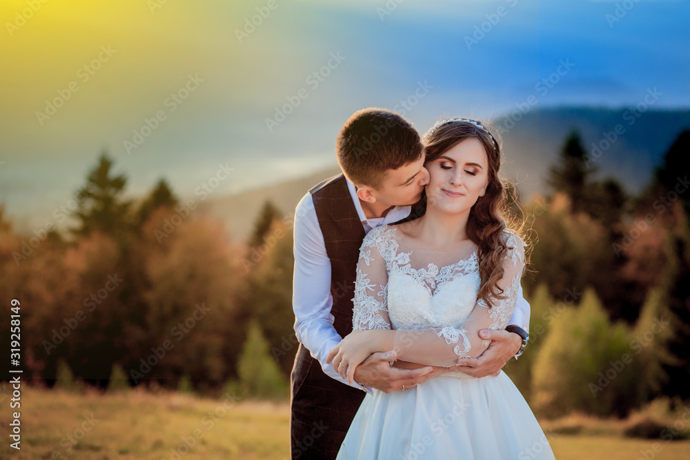 Fototapeta premium Bride and Groom at Sunset Romantic Married Couple
