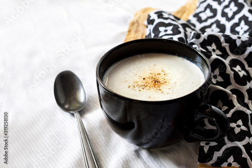 Cauliflower Soup (Creme du Barry) in black bowl photo