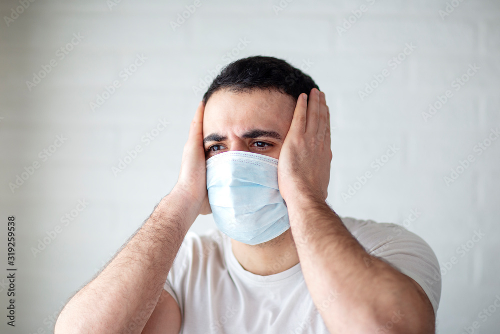 Young man standing with mask on his face Young man standing with mask on his face