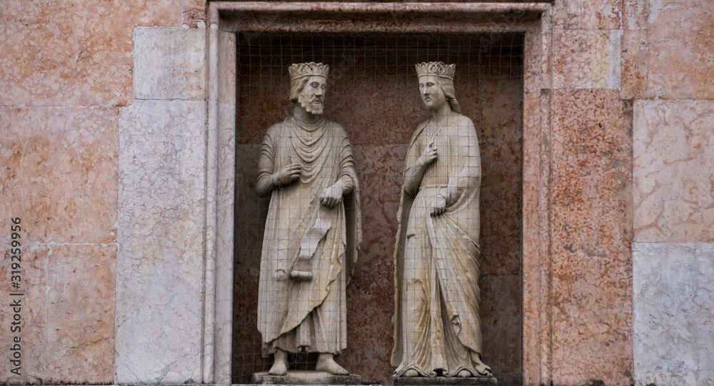 King Solomon and Queen Sheba, statues on a facade of the Baptistery in Parma, Italy